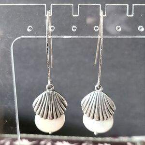 Sterling shell and coin pearl earrings.